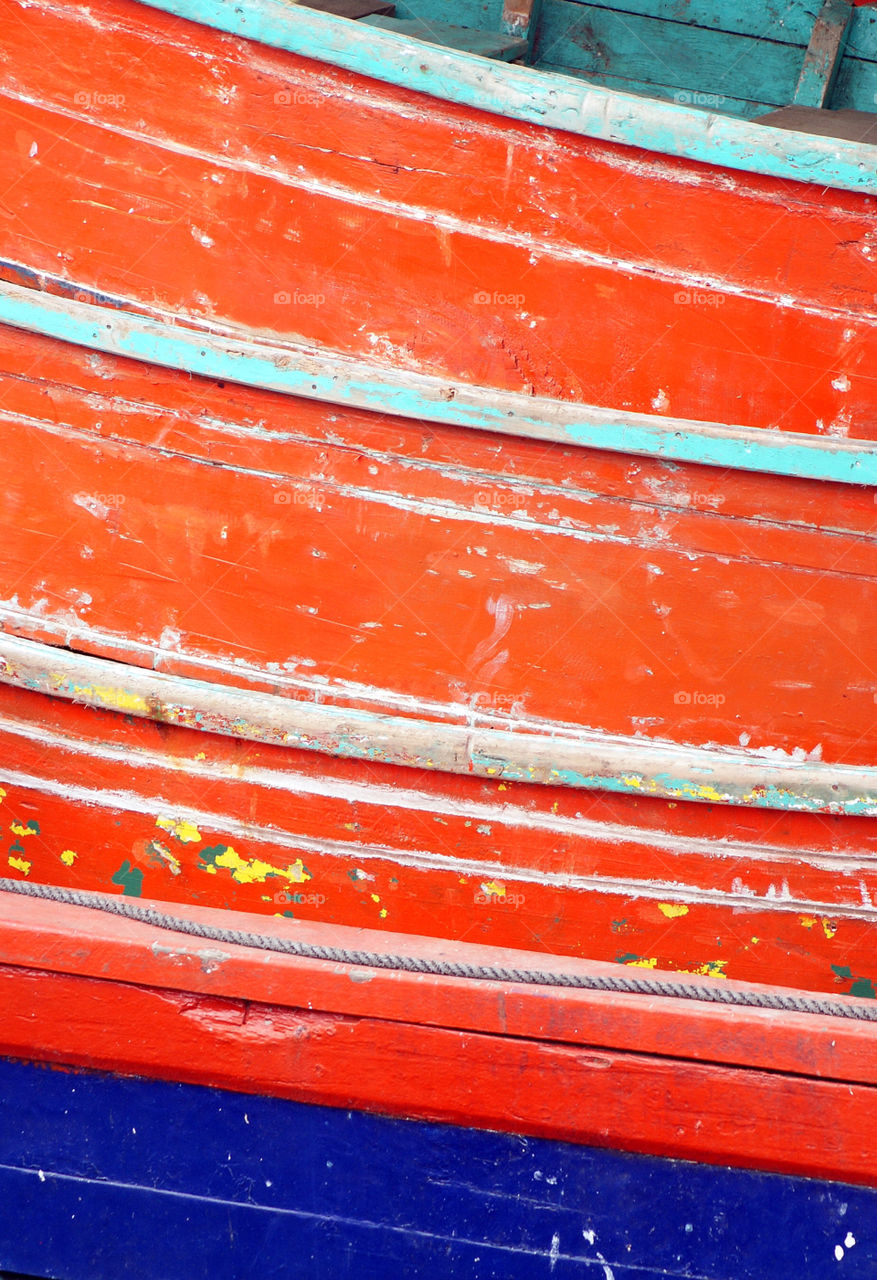 Peeling paint on rusted metal surface