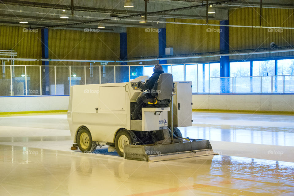 Ice resurfacing machine in work.
