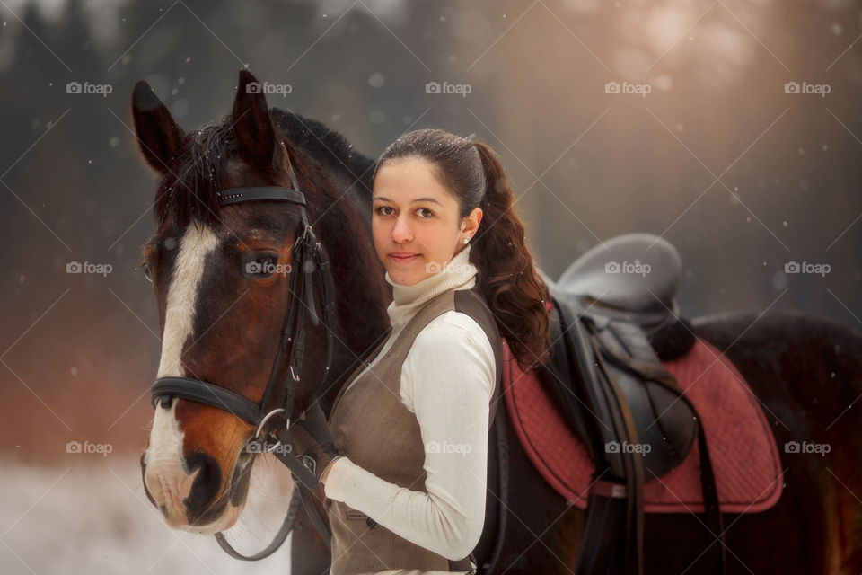 Young beautiful woman with horse outdoor portrait at spring day