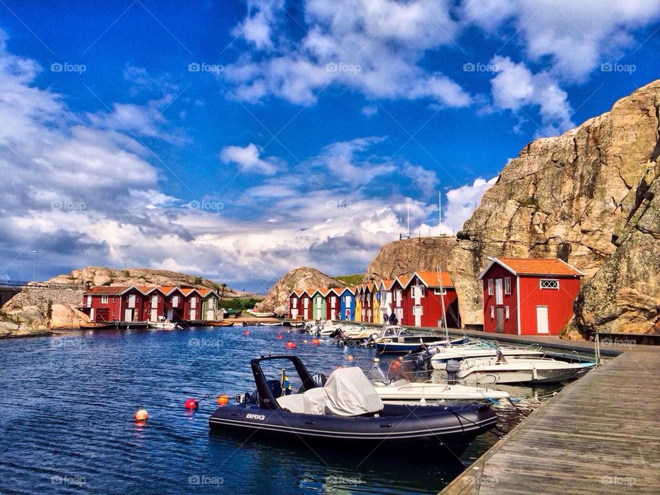 Boats moored at harbor in Smogen, Sweden