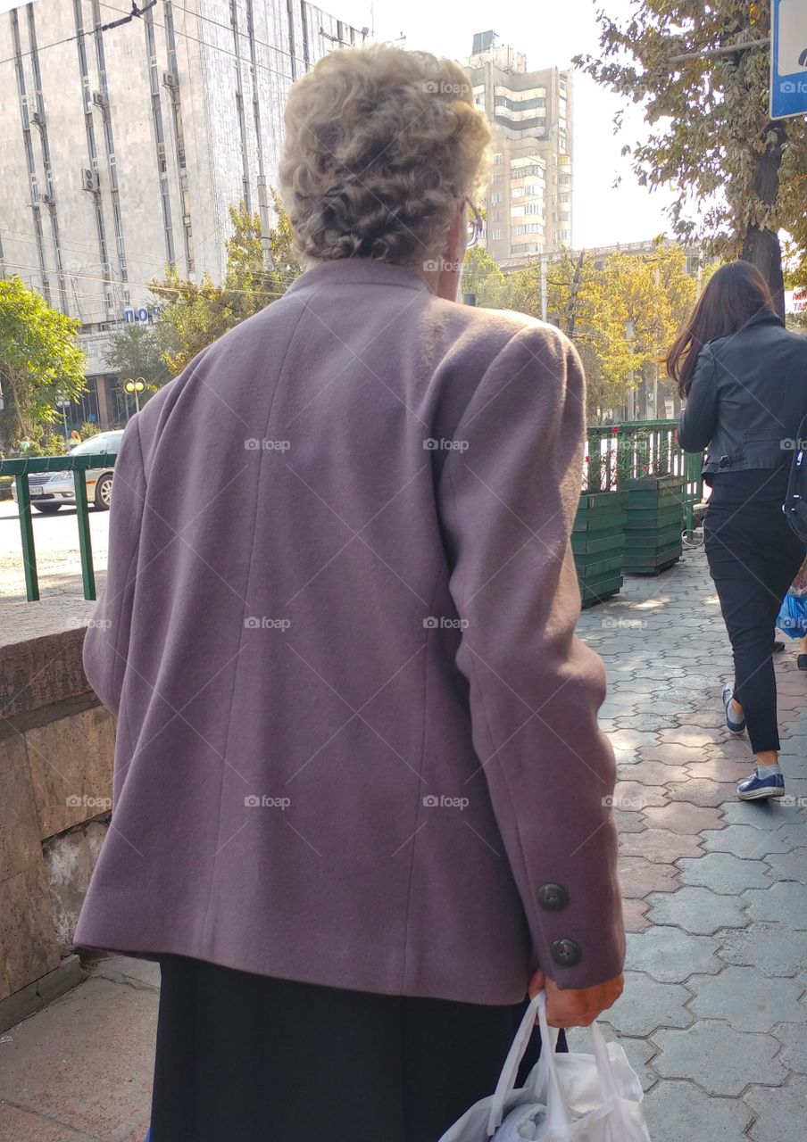 This lady was walking with her little grand daughter.