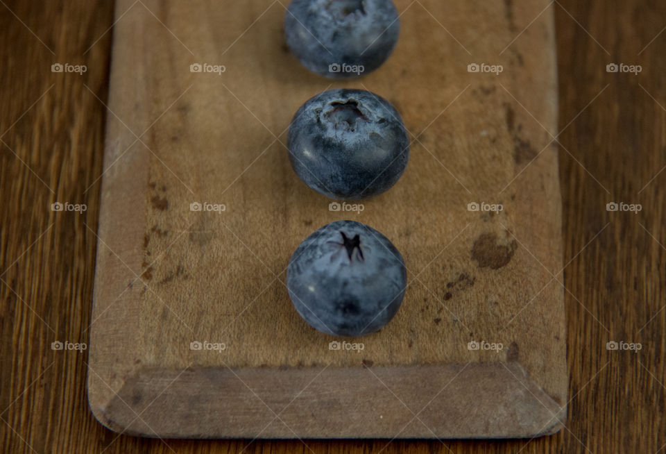 Blueberries on cutting board