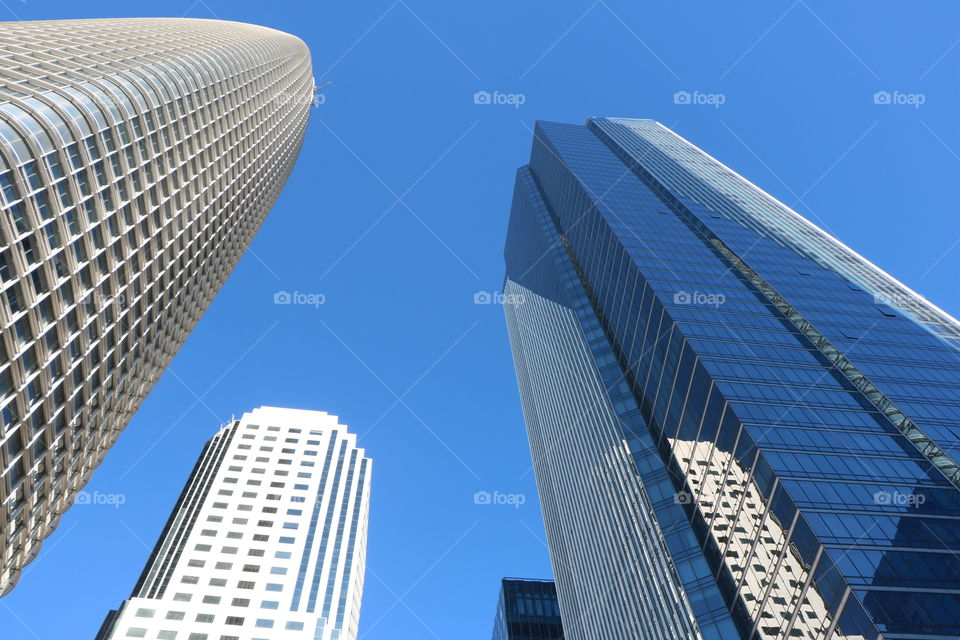 Skyscrapers reaching up in the blue sky