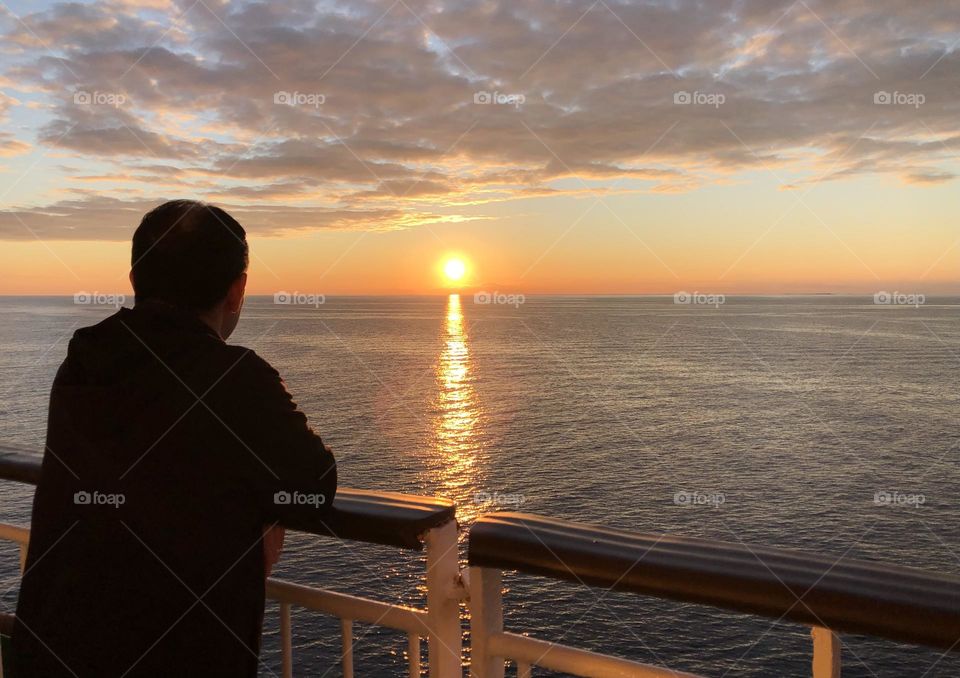 Enjoying a summer sunset on a cruise