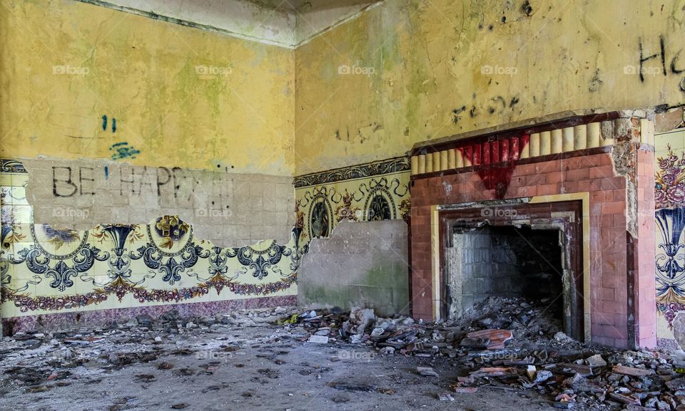 Fireplace and remnants of tiling at the abandoned Art Deco Hotel da Foz da Sertã, Portugal 
