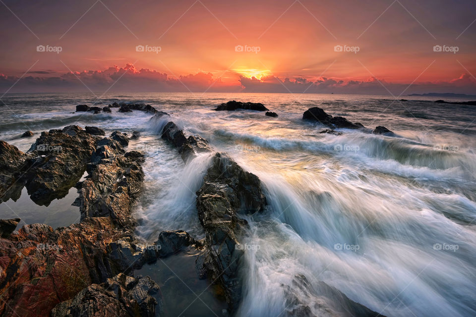 The Rushing Pandak. Sunrise with motion waves at Pandak Beach, Terengganu