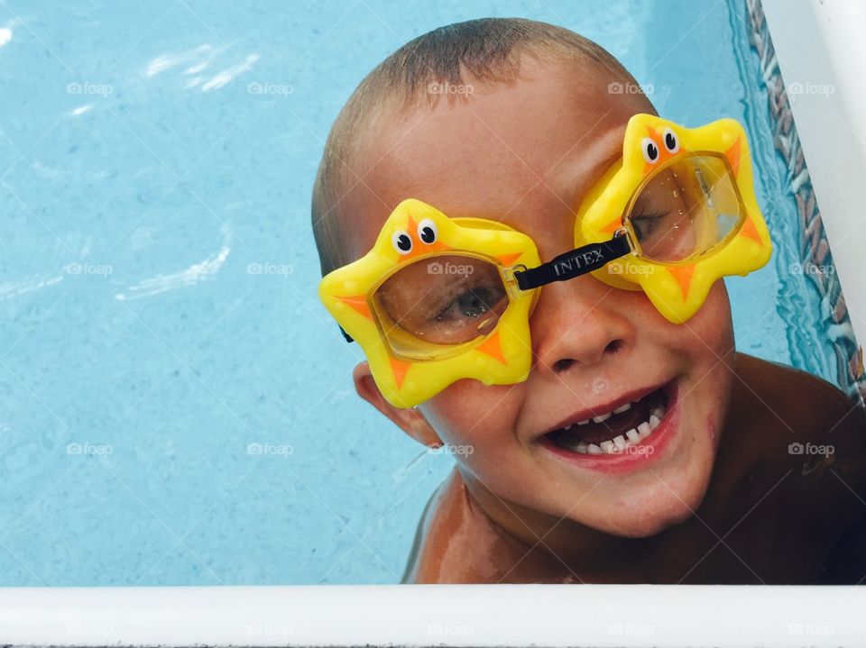 Boy wearing starfish goggles