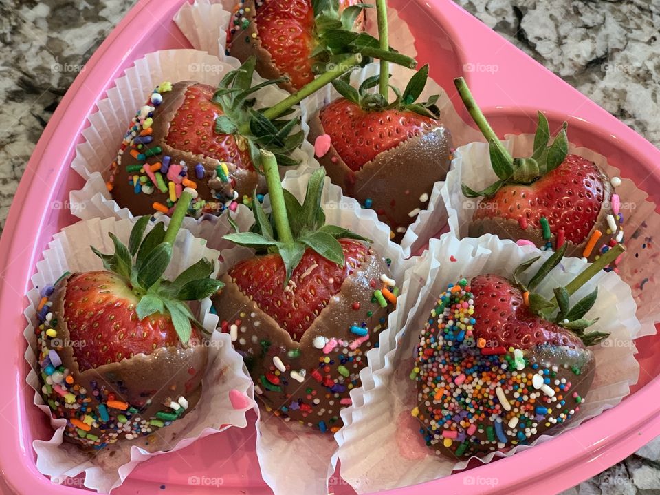 Decorated chocolate covered strawberries for Mother’s Day front of my husband