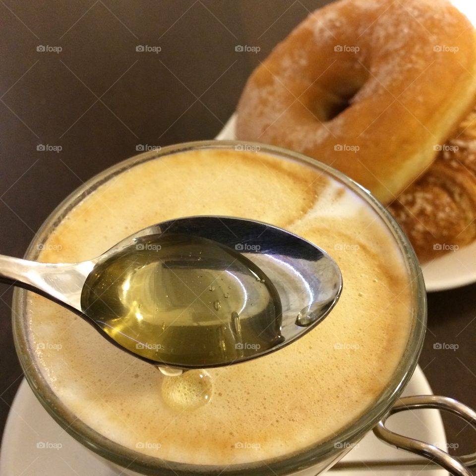 Cappuccino with honey,donut and brioche