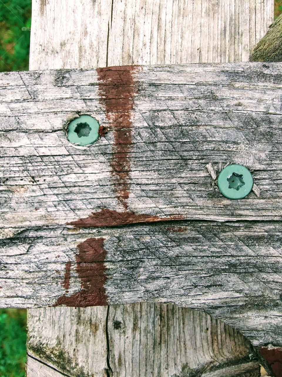 face in weathered wood