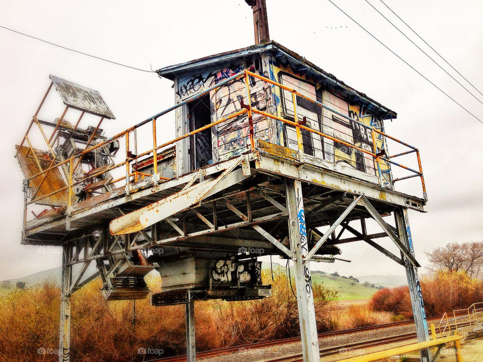 Abandoned railroad building covered in graffiti