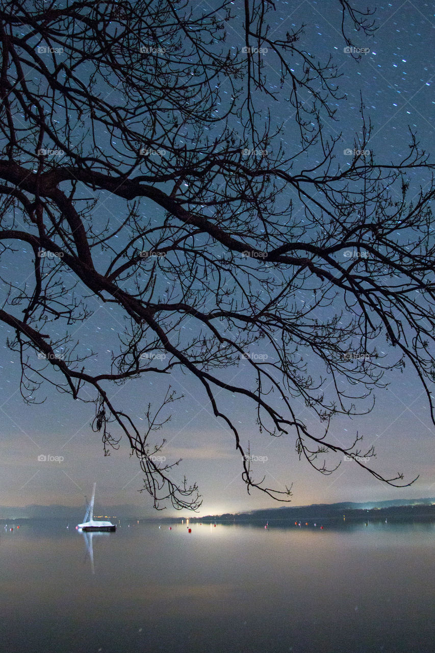 View of sailboat in sea at night