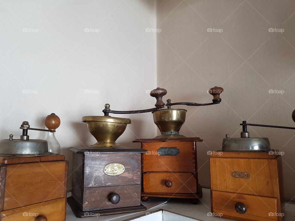 old retro vintage coffee grinder collection set as decoration in a kitchen