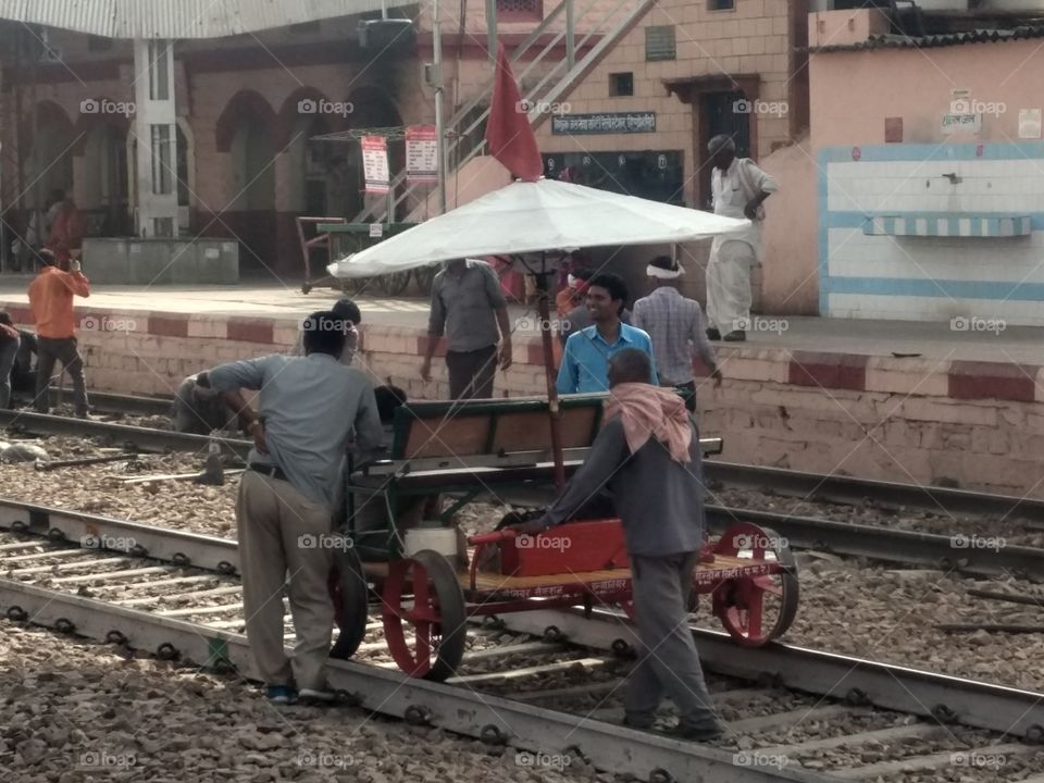 railway servent working on railway track