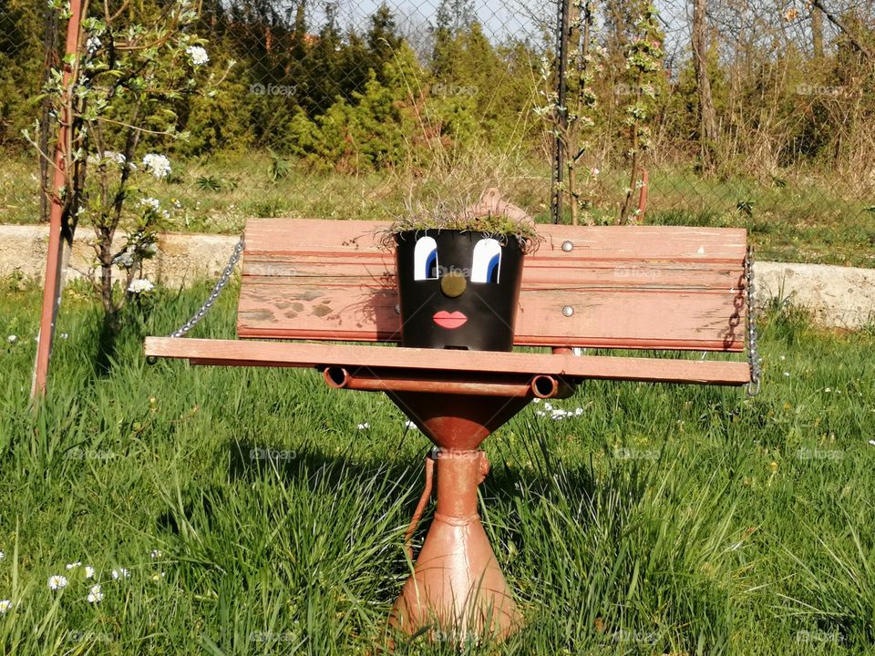 Summer is coming, covid 19 is here, keeping distance but life is moving on. The park benches are empty but not for long.