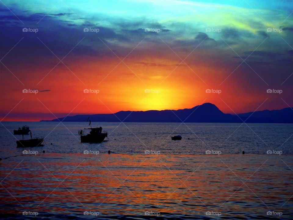 Emerald Sky over the red sunset . (Praia - Italy ).