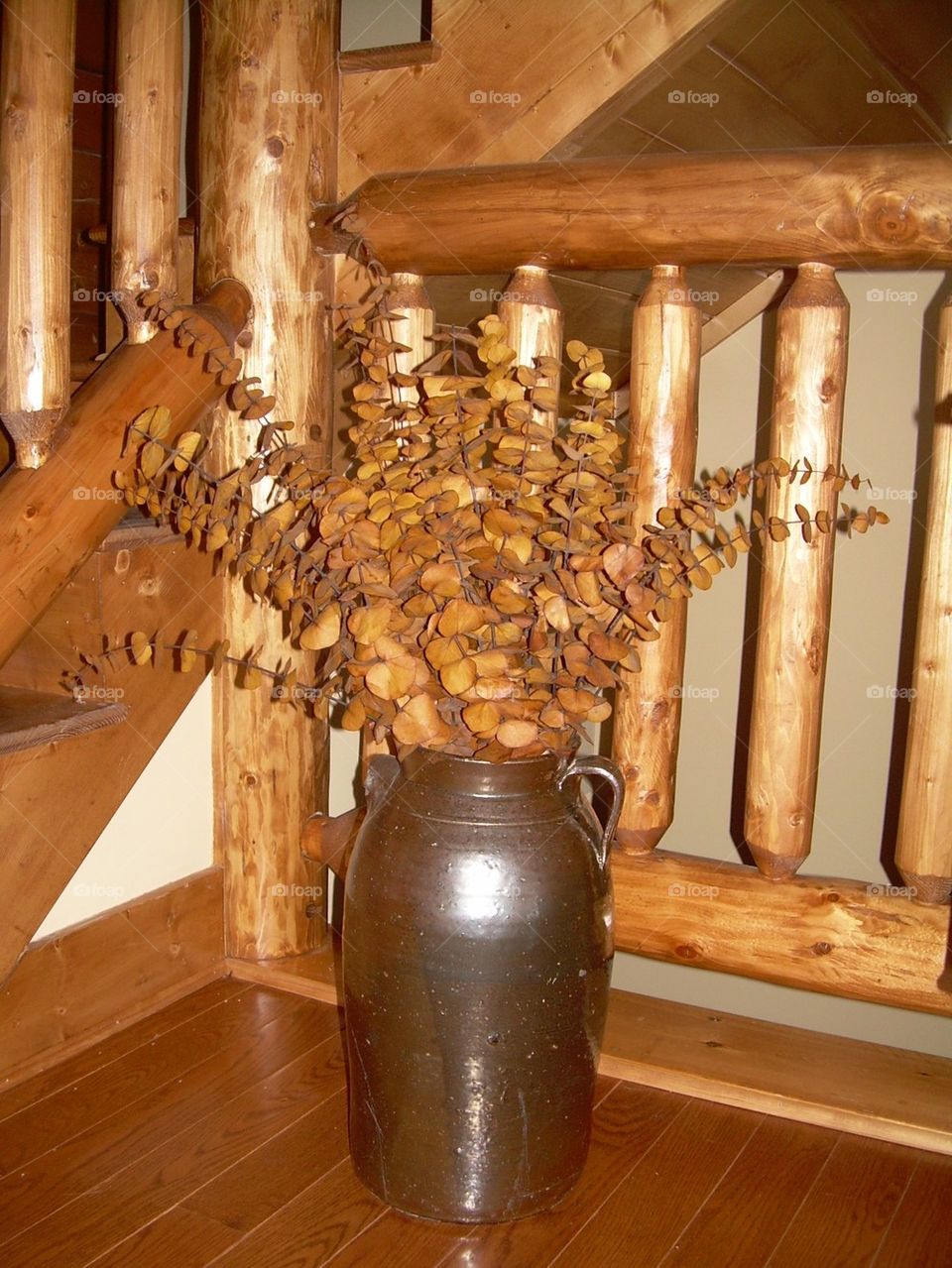 Antique milk jug with flowers