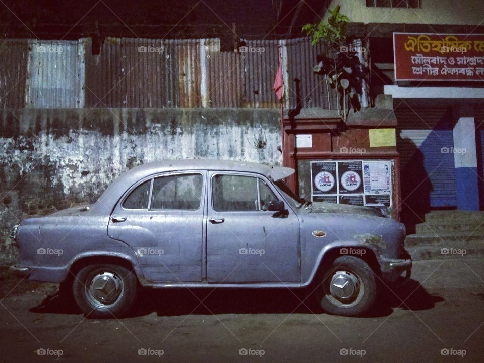 An old ambassador car, on the street of Calcutta.