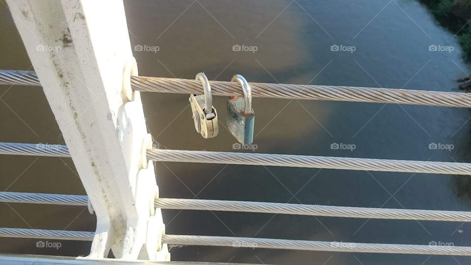 Locks on a bridge symbolizing eternal love