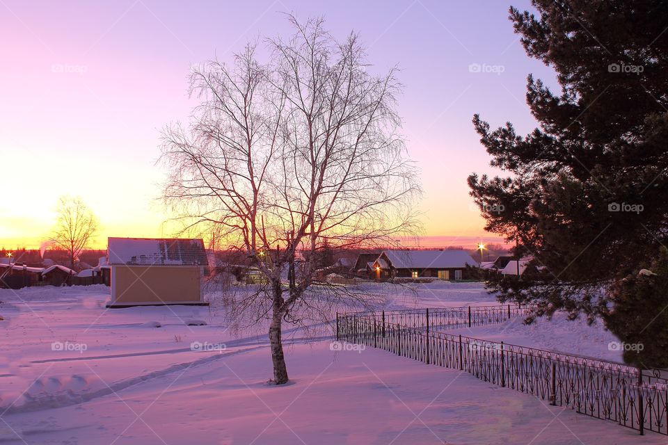 colourful sunrise in the winter in the village