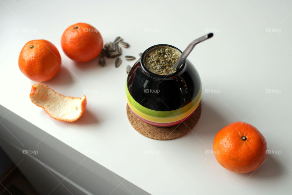 Yerba time with oranges in winter days