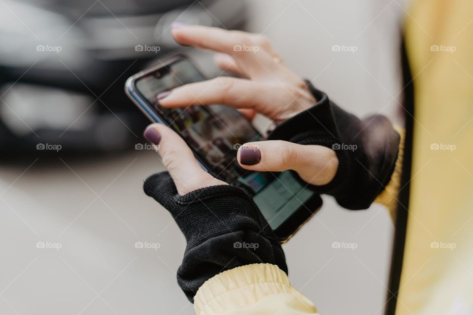 close up shot of woman using mobile device / phone / social media