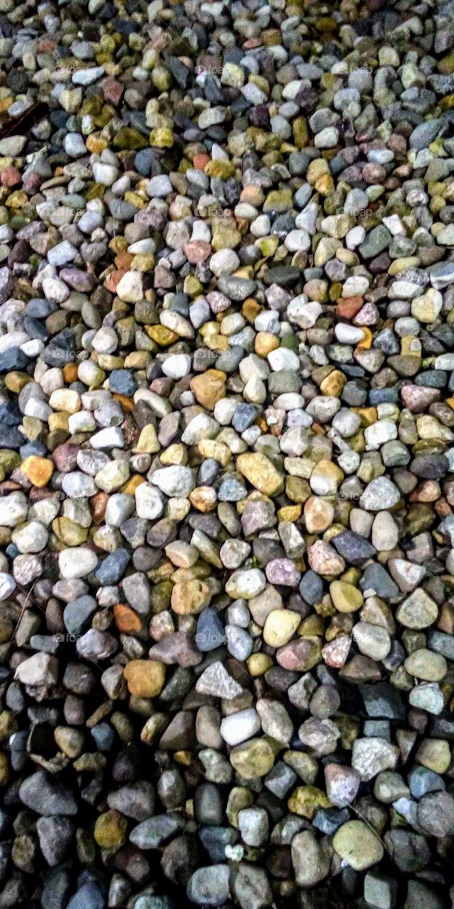 pile of  colorful river rocks used as landscape