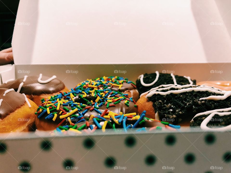 Warm, delicious, donuts in a polka dot box.
