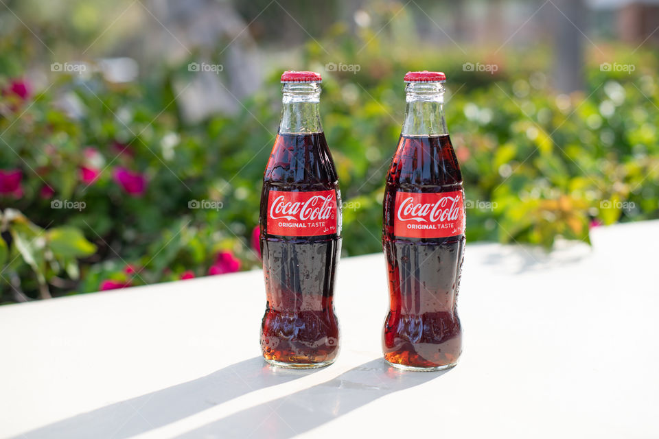 Two bottles of Coca-Cola