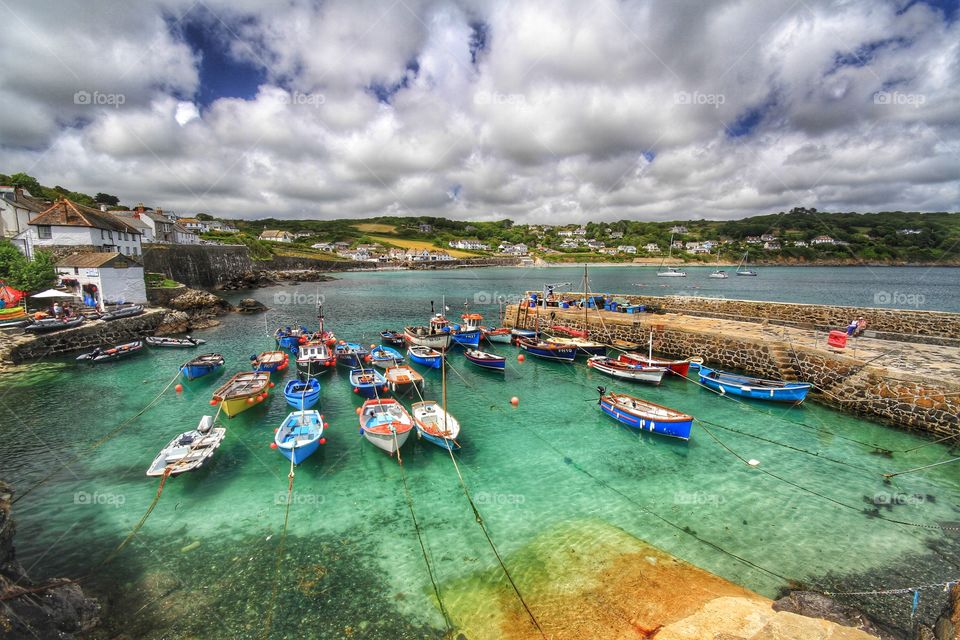 A beautiful Cornish harbour called Coverack full of fishing boats.