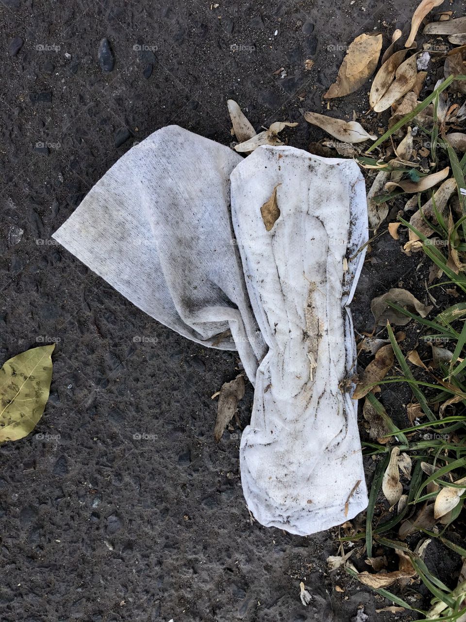 dirty feminine sanitary napkin thrown in public space