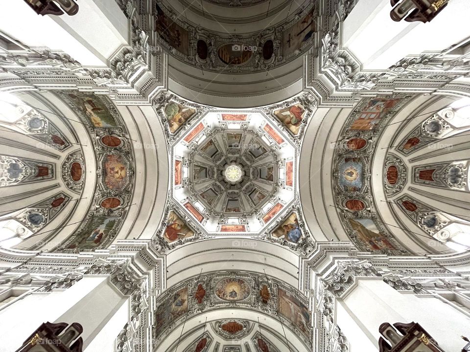Amazing architecture, looking up on the beautiful ceiling in the Salzburg Cathedral Austria 