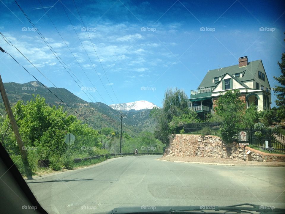 Snowy Pikes Peak with cool house on hill