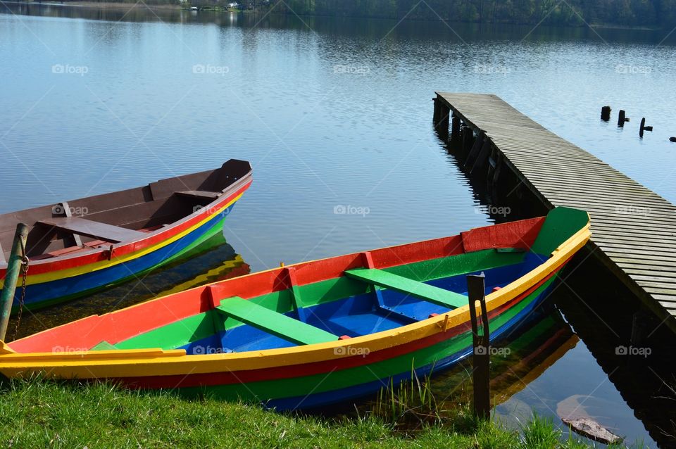 colorful boats and footbridge