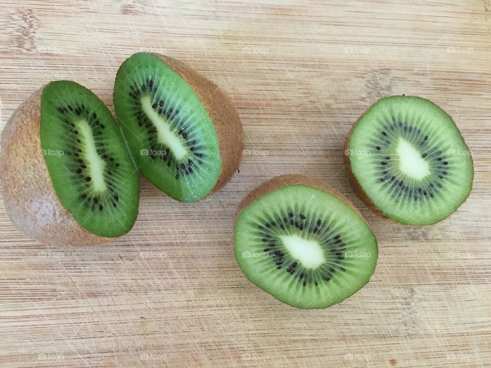 Kiwi fruit on bamboo board 
