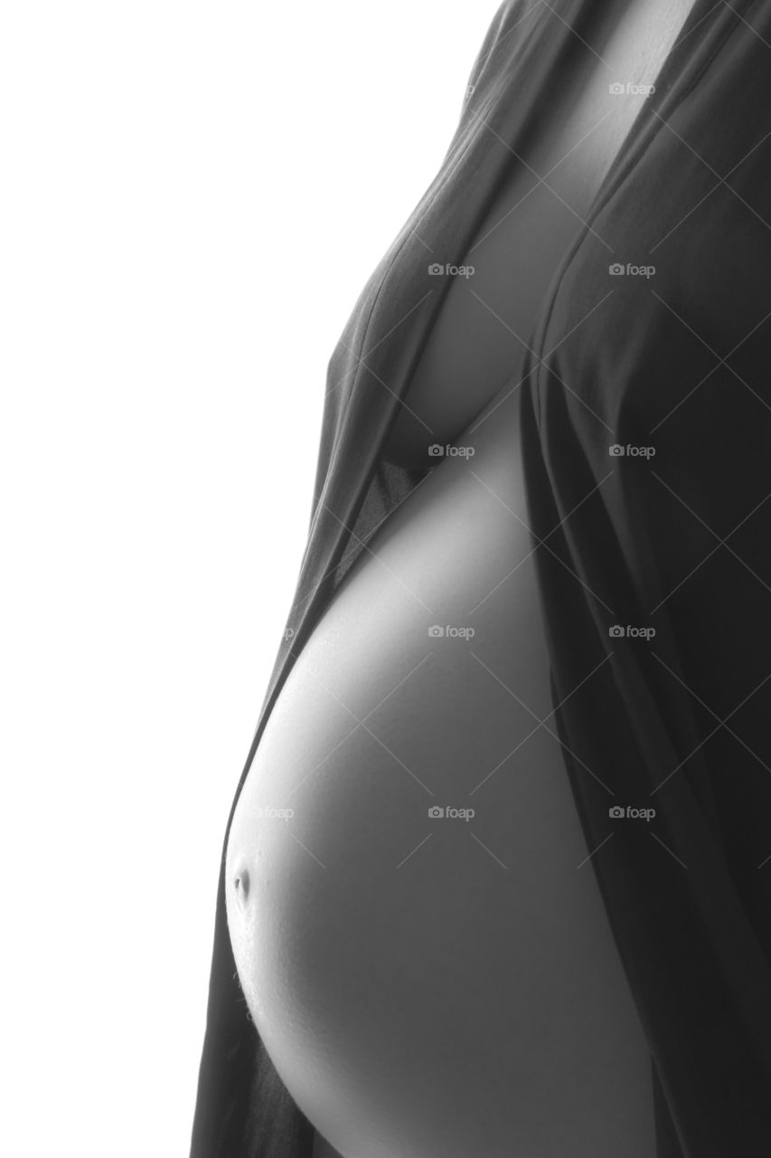 Maternity shoot. Pregnant model with lingeri