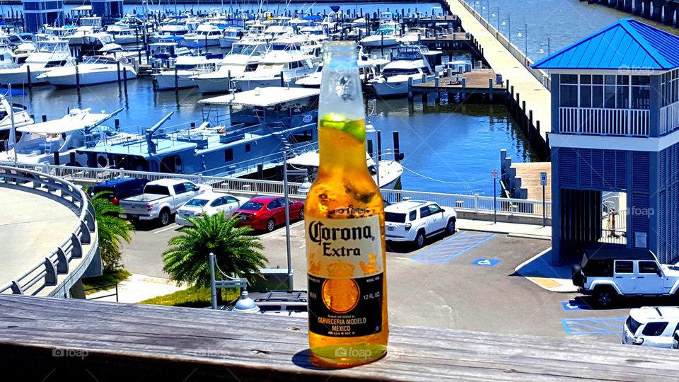 having a corona on the deck. great view of the harbor in mississi