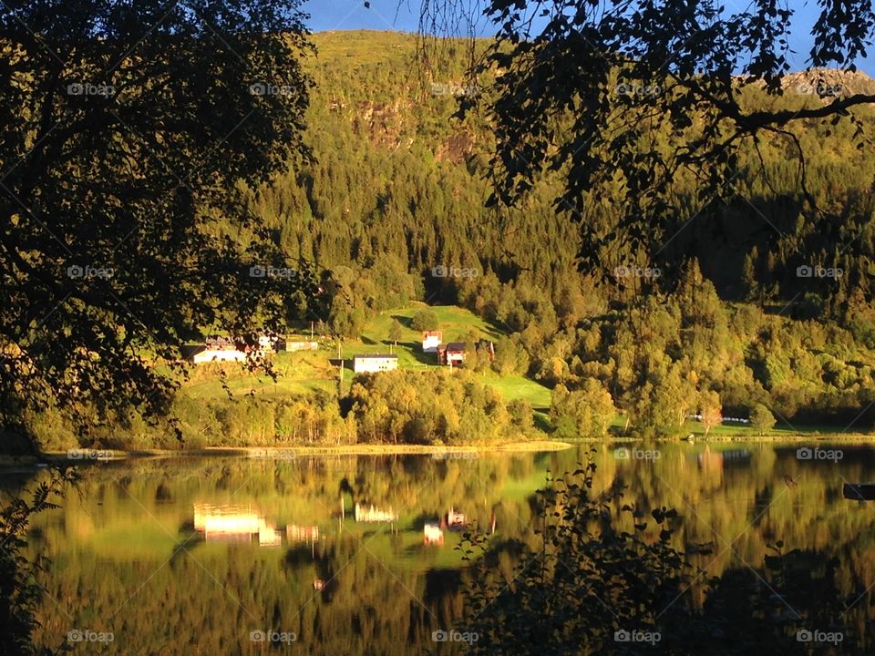 Reflection of houses and mountain in autumn