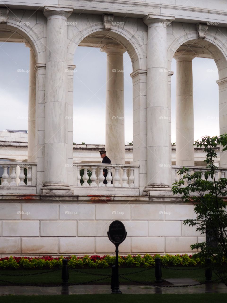 Unknown soldier memorial. Officer walks by. Washington, Arlington Cemetery Pentagon