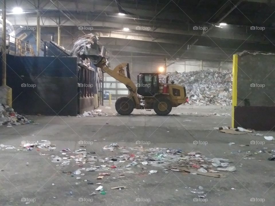 bulldozer feeding drum feeder system recycling center
