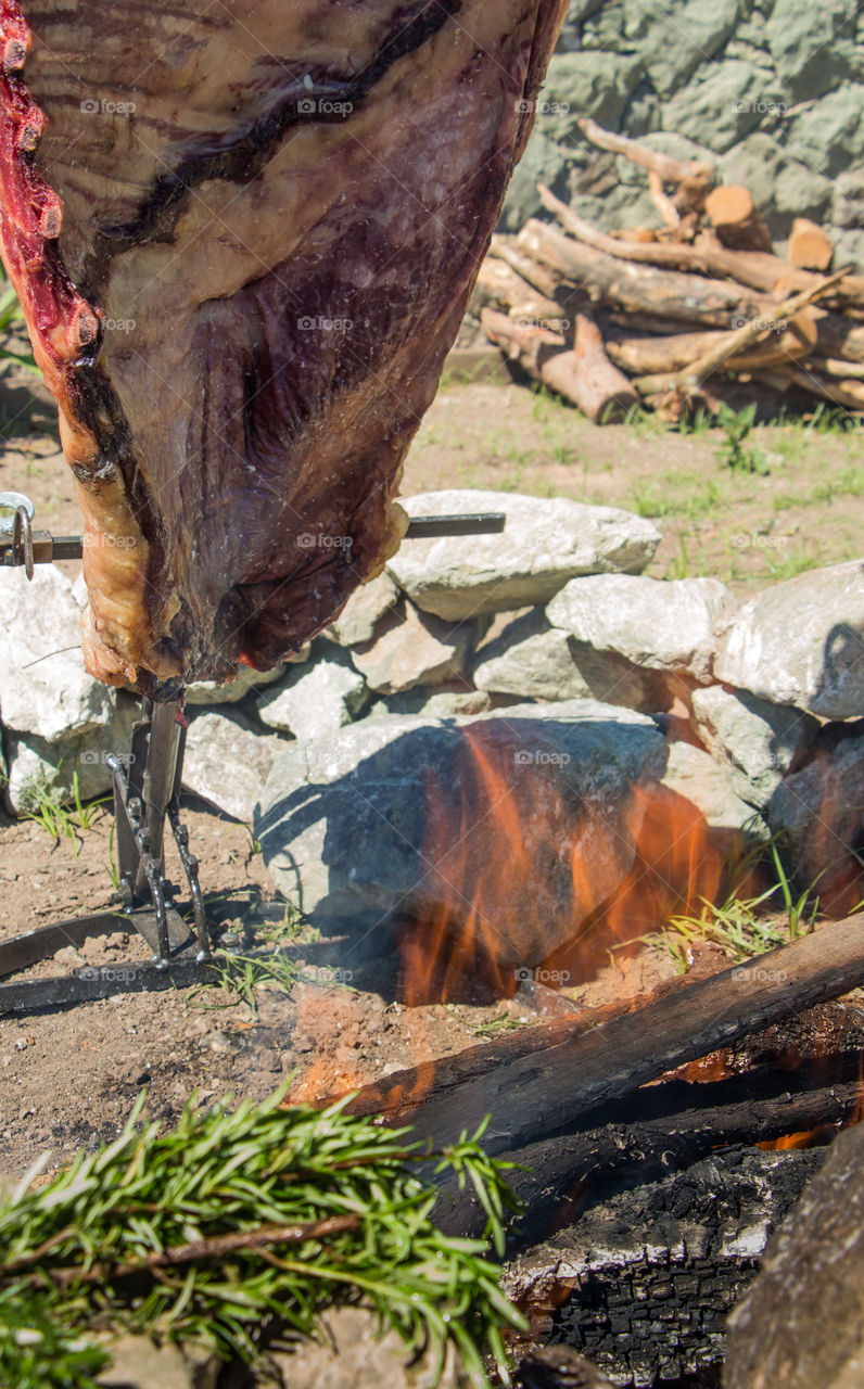 cooking cow meat with flames