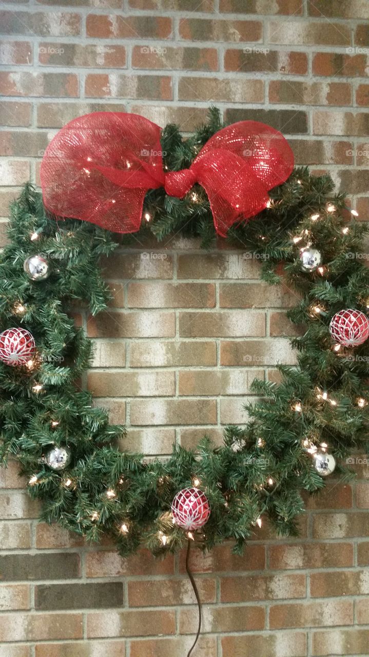 wreath on brick wall