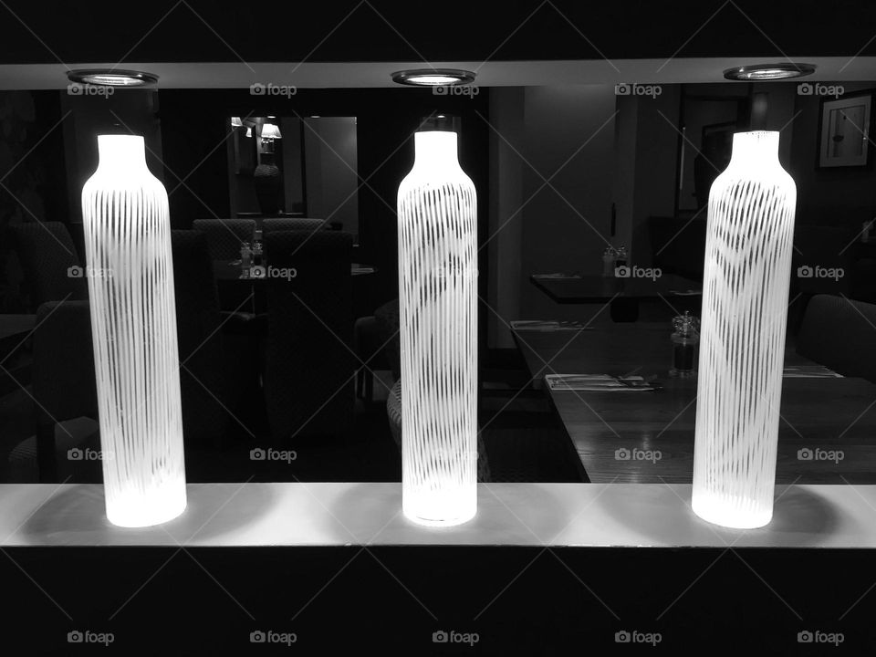 Lighting glowing in a restaurant setting black and white