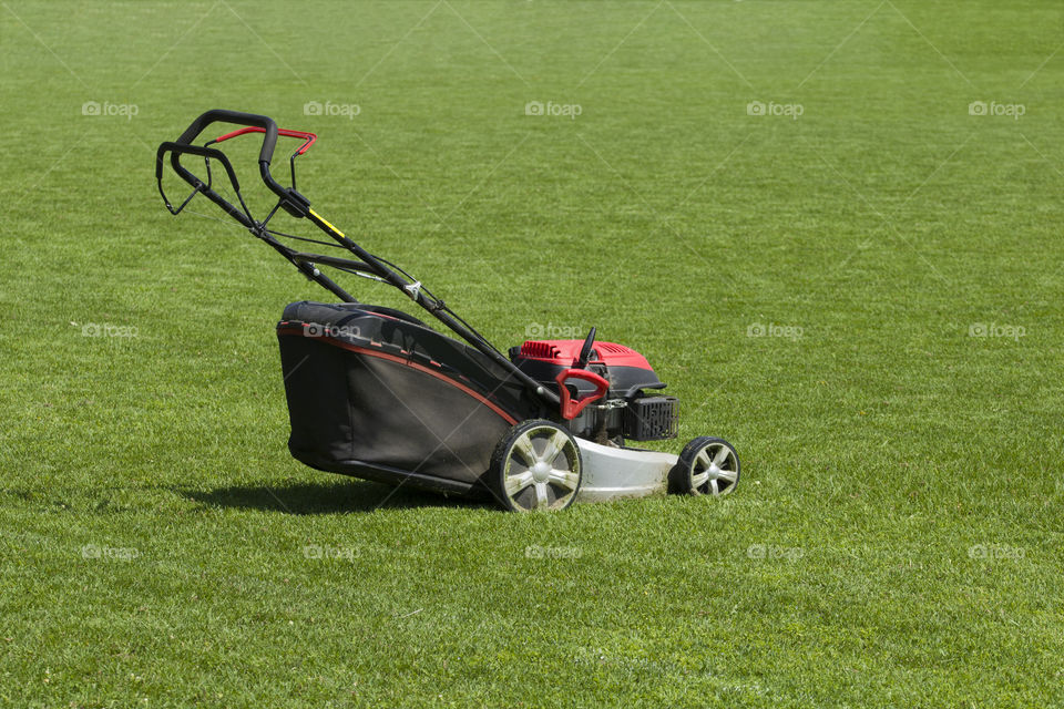lawn mower on green field