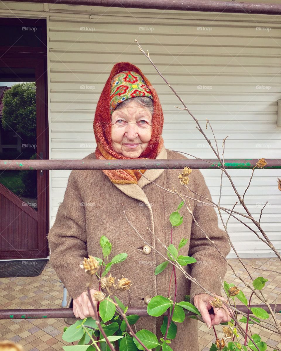 My smiling 86 y.o.  granny in the yard.
My granny when getting problems with her health she found her inspiration in drawing. For today she has about 15 albums of beautiful illustrations made by ink.