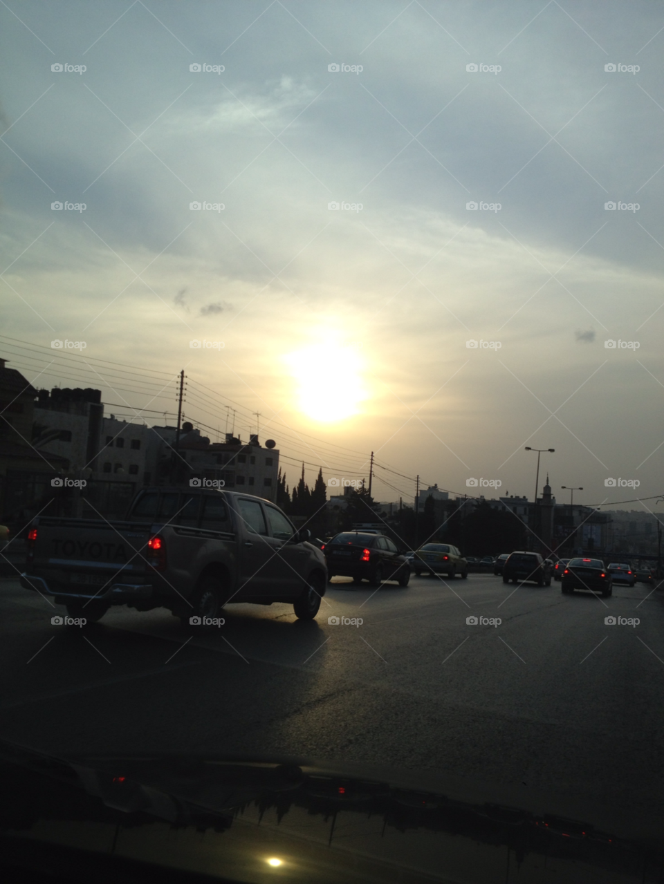 city car sunset clouds by a.bilbaisi