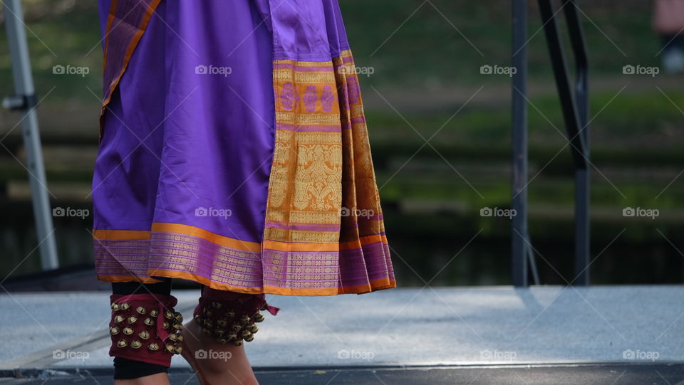 Indian dancers wearing costume and dancing bell anklets for the festival season.