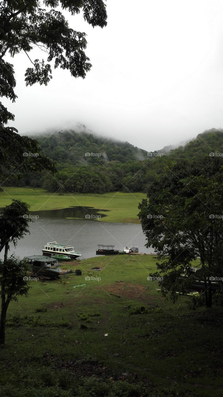 Misty mountains near a lake