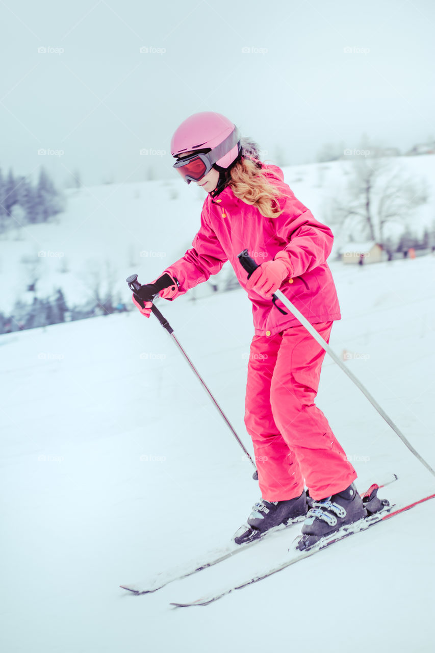 Girl skiing down the slope