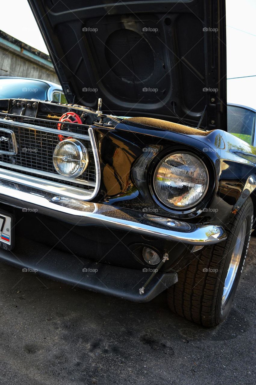 ford mustang with open hood for repair